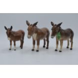 A trio of Beswick Donkeys (3). In good condition with no obvious damage or restoration.