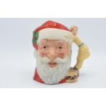 Large Royal Doulton character jug Santa Claus D6668 with toy doll handle. In good condition with