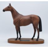 Beswick connoisseur model of Red Rum on wooden base, 32cm tall. In good condition with no obvious