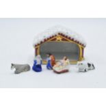 An unusual Limoges Nativity set to include a stable, Mary, Joseph, Jesus and animals (6). Stable 9cm