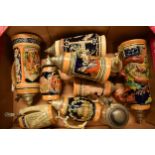 A collection of vintage 20th century German stein ceramic and metal tankards of varying forms and