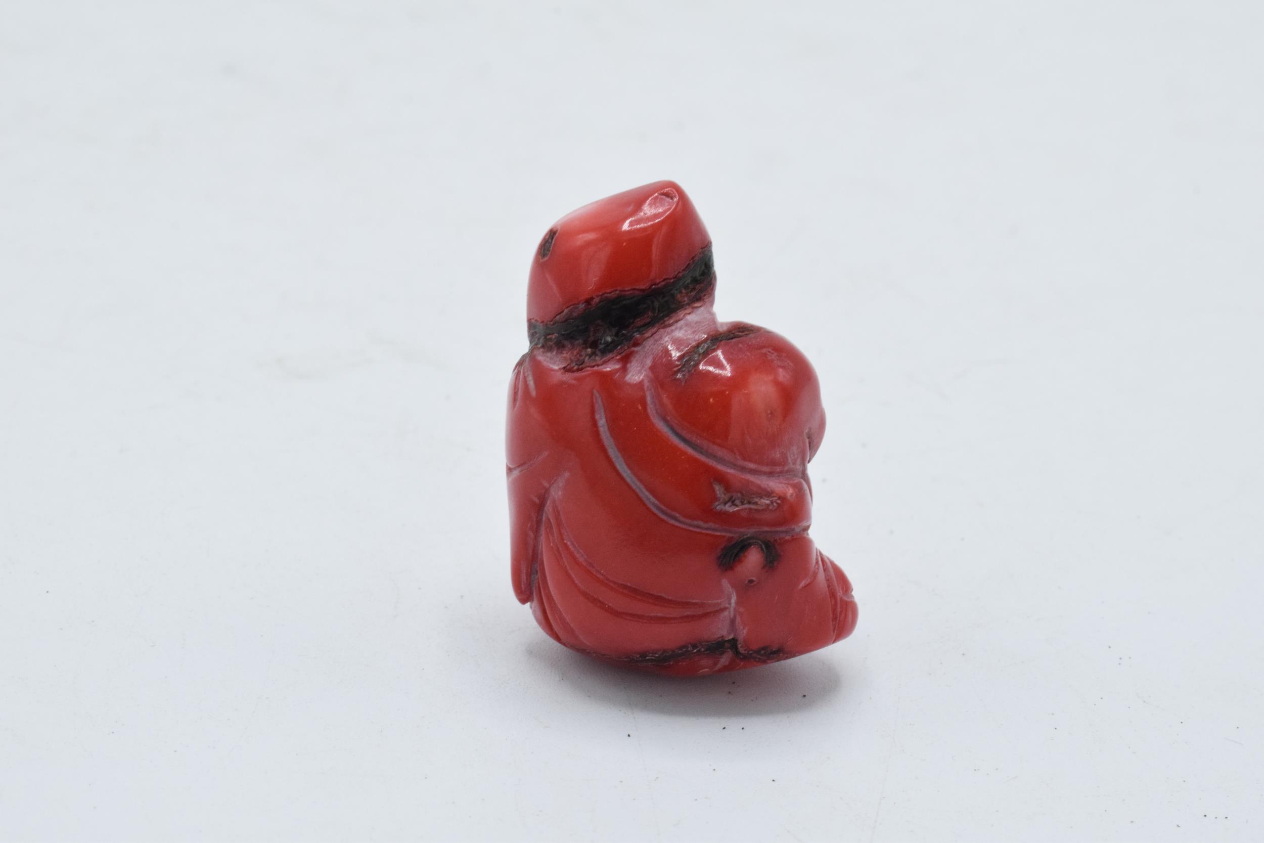 Red hard stone Netsuke type toggle with small pierced hole through top section, 4cm tall. - Image 2 of 3
