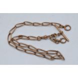 9ct rose gold Albert link chain with T-bar, 27.5 grams. Each mark individually marked. 41cm long.