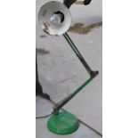 A vintage 20th century green anglepoise lamp with round base, approx 95cm tall at tallest. Untested.