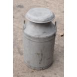 Vintage milk churn with lid, 61cm tall, split to one side.