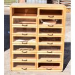 20th century wooden and glass haberdashery chemists shop bank of drawers with glass fronts, 90 x