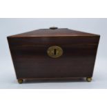 19th century wooden tea caddy of sarcophagus form with brass ball feet and brass handle. 28cm