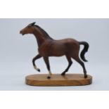 Beswick matte brown horse on wooden base, tail af. The piece displays well though the tail has
