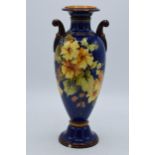 Doulton Lambeth Faience vase on dark blue back ground with twin handles (slight af). In good