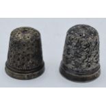 A pair of silver hallmarked thimbles, 12.2 grams (2). Hole in one and repair to the other.