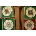 A collection of Royal Doulton plates with Christmas themes, mostly as new with boxes and