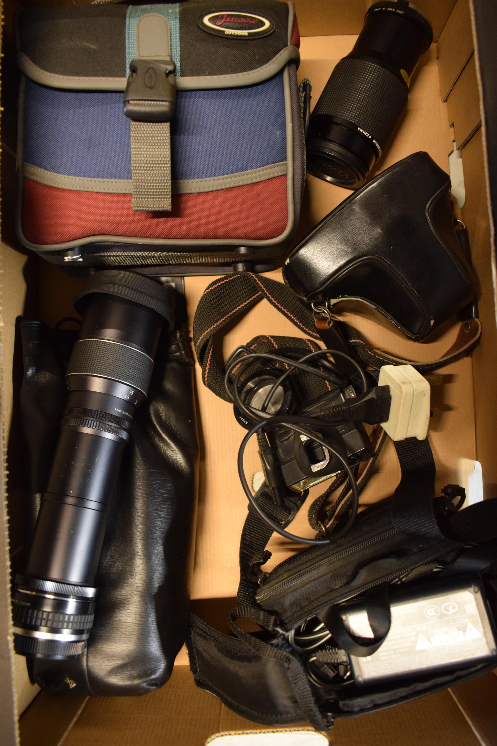 A collection of cameras and equipment to include Olympus 2X OP Teleplus MC4 lens, Olympus OM10,