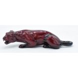 Royal Doulton flambé crouching tiger, 25cm long. In good condition with no obvious damage or