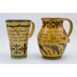 A pair of Devon Motto ware jugs in similar traditional colours to include 'come fill me with