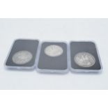 A trio of silver crowns in plastic cases to include QV 1888, G IV 1821 and QV 1847 (3).