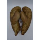 A pair of vintage leather boxing gloves (2).