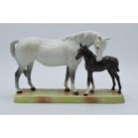 Beswick grey mare and brown foal on ceramic base 1811, minor chip to one ear. Piece displays well