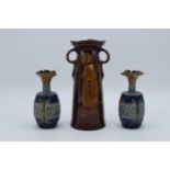 A pair of Doulton Lambeth stoneware vases together with Kingsware Monks in the Cellar vase (all with