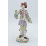 19th century continental figure, in the style of Meissen, Chelsea or Derby, of a gentleman wearing a