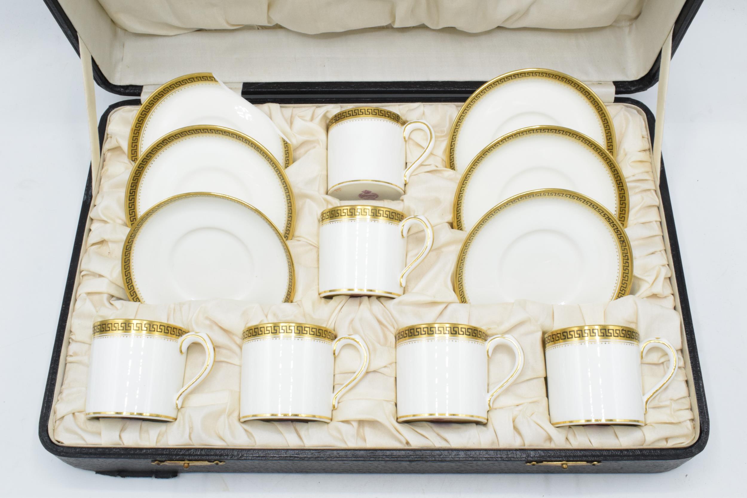 Cased Minton coffee set to include 6 cups and 6 saucers decorated with a Grecian Key style design (