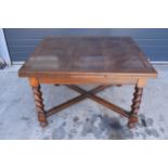 Early to mid 20th hardwood extending dining table with pull-out leaves and diagonal supports. 121