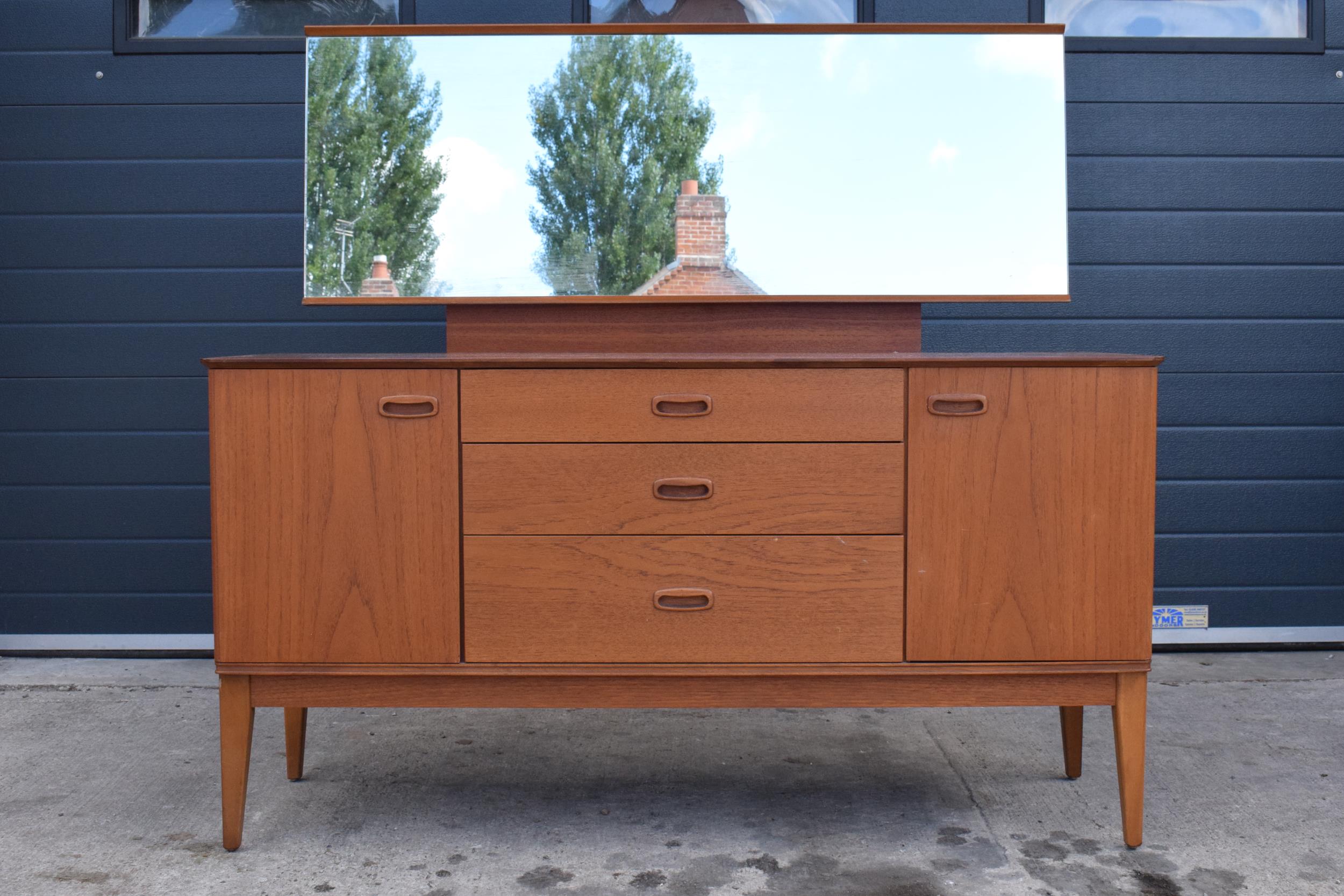 Austinsuite mid century teak mirror backed sideboard / dressing table, 133 x 46 x 122cm tall. Age-