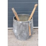 A vintage galvanised dolly tub, 52cm tall, together with accessories to include wash board, wooden
