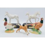 A collection of Beswick to include matte white Adventure and Springtime, palomino foal and 2 John