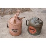 A pair of Aladdin vintage fuel cans together with Aladdin Pink Paraffin heater (53cm tall)