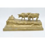 A cast metal inkwell in the form of an mountainous cattle scene, 32cm long. No glass liner.