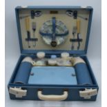 A 1960s/70s Brexton picnic set in blue case to include flasks, cutlery and crockery (one side