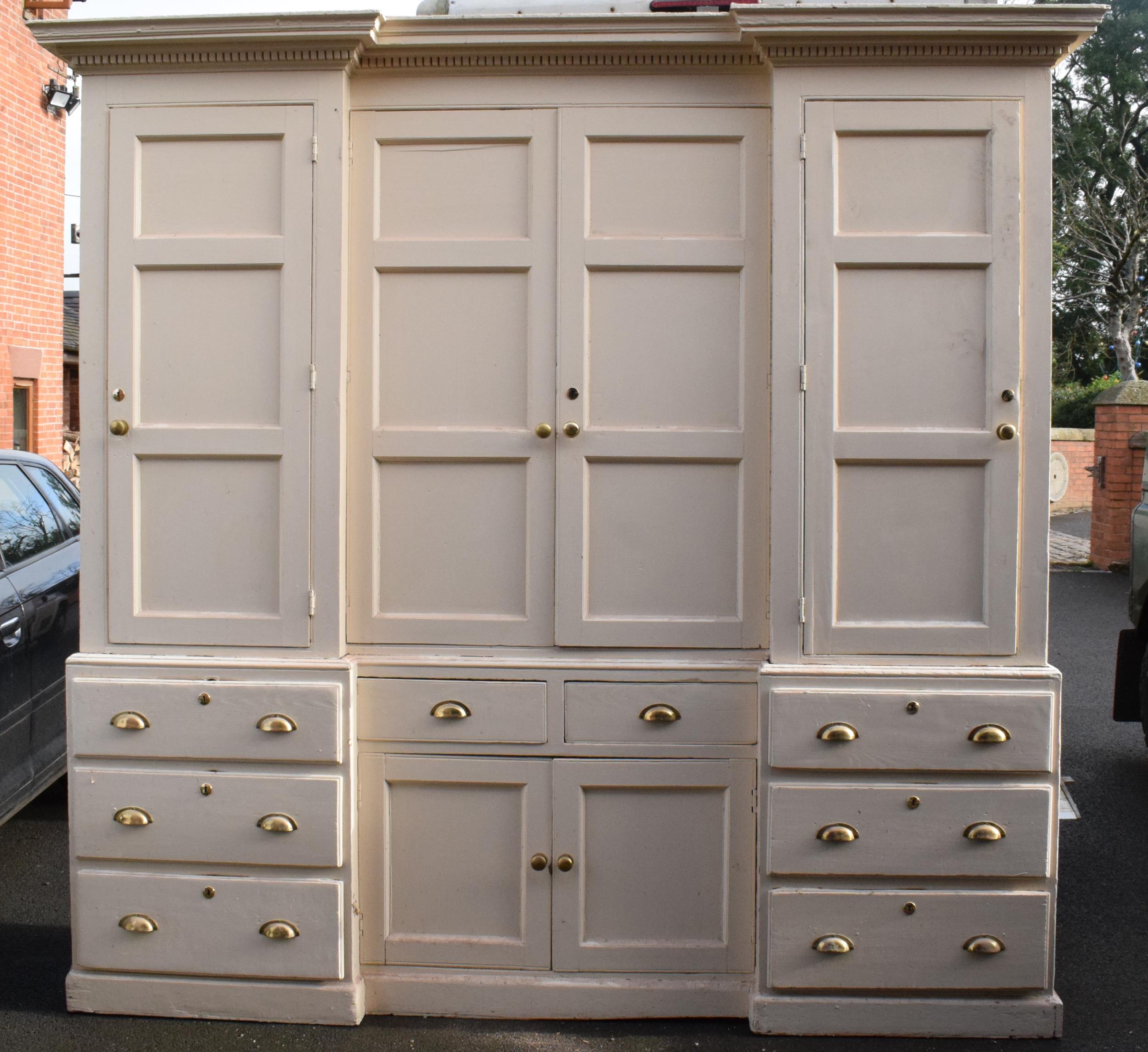 19th century painted breakfront housekeepers cupboard with brass handles and effects with a