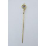 9ct gold stick pin set with sapphire, 1.2 grams, 6cm long.