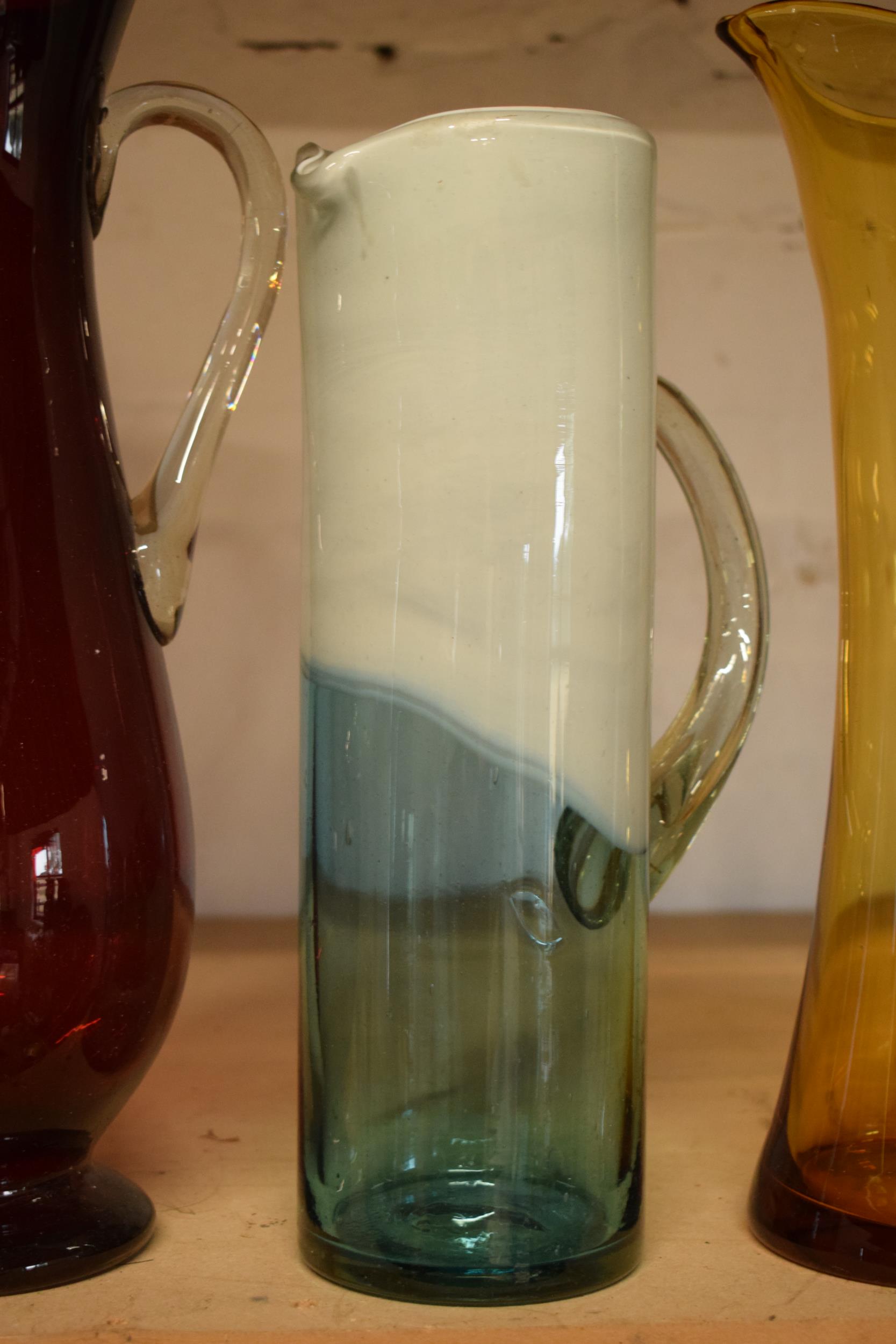 A collection of assorted art / studio glass in the form of jugs (4), tallest 44cm. Condition is - Image 3 of 5