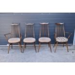 A set of 4 mid century Ercol spindle-back chairs to include 2 arm chairs (4). 97cm tall. Age-related