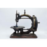 Late 19th century Prima Donna hand propelled sewing machine. Age related wear, needing some