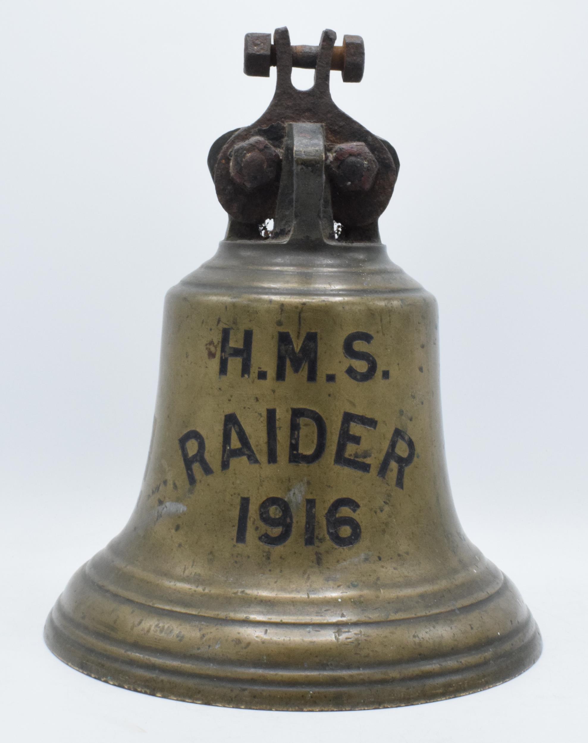 World War One original brass ship's bell 'H.M.S. Raider 1916' with clanger. 32cm tall, 26cm wide.