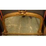 19th century over mantel mirror of arched form with gilt moulded frame with fern detail, 114cm wide.