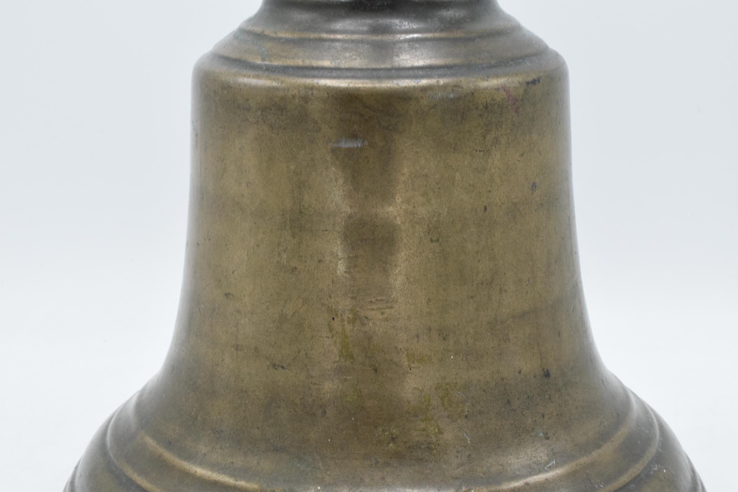 World War One original brass ship's bell 'H.M.S. Raider 1916' with clanger. 32cm tall, 26cm wide. - Image 9 of 15