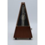 Vintage 20th century wooden cased metronome Made in German Democratic Republic, 24cm tall. Sold as