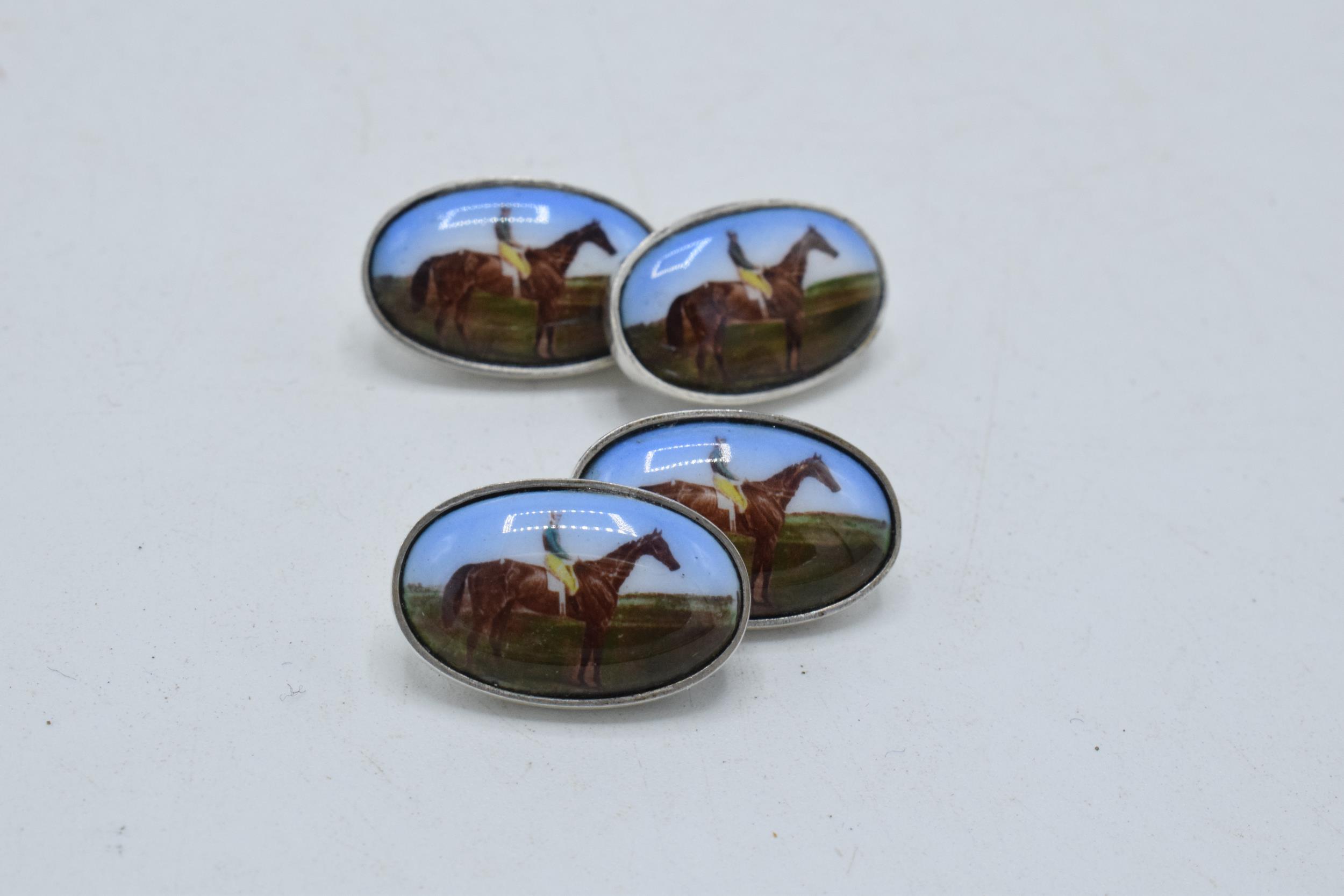 A pair of silver and enamel cufflinks decorated with jockeys (2). - Image 2 of 2