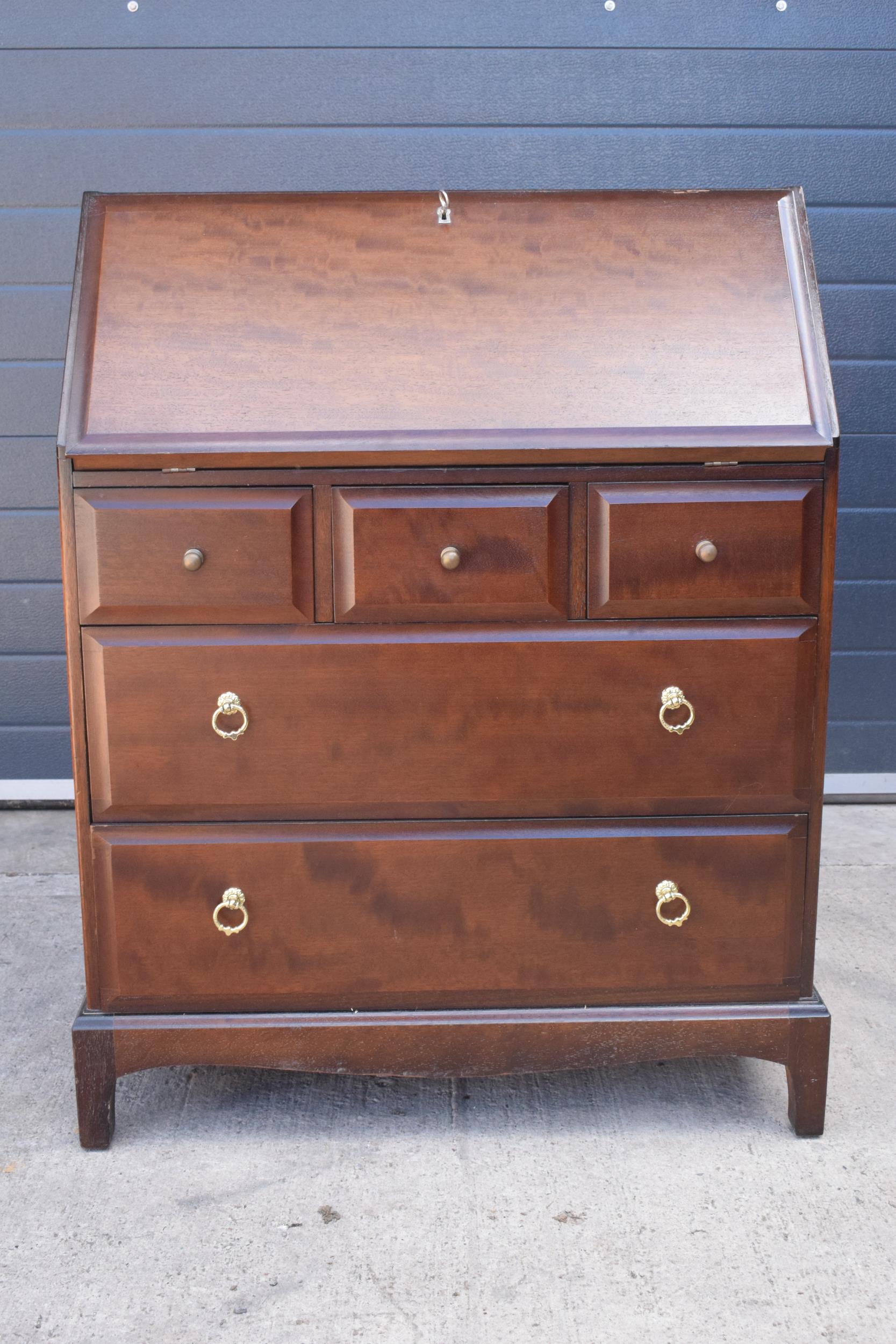 Stag mid-century brown bureau with leather inset to interior. 76 x 46 x 98cm tall. Age-related