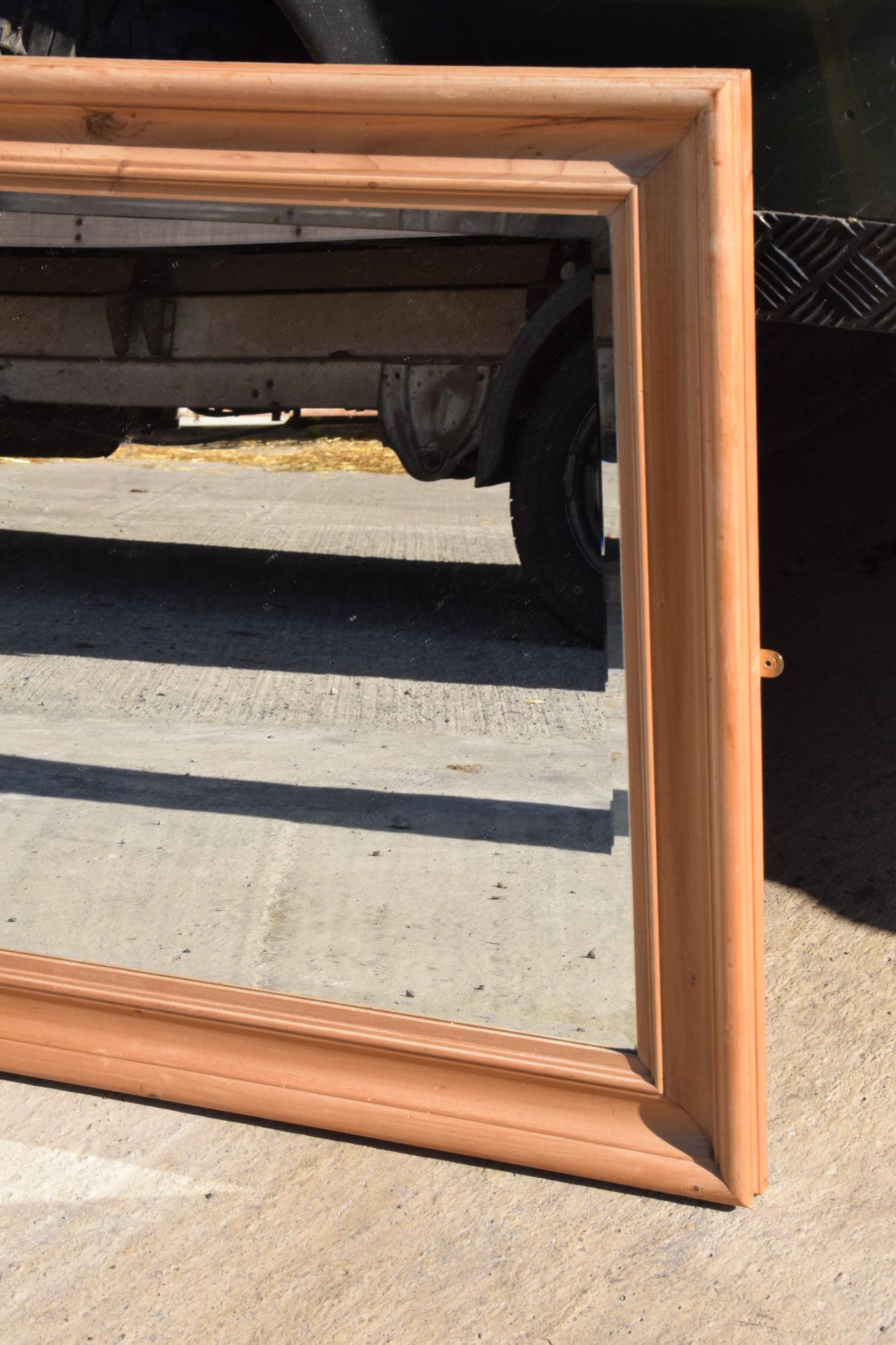 A vintage 20th century pine wall hanging bevel-edged mirror, 96 x 77cm. - Image 2 of 5