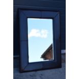 Leather bound wall mirror, 106 x 80cm tall. Modern.