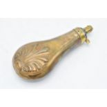 19th century copper embossed powder flask, 19cm long. Some denting as expected.