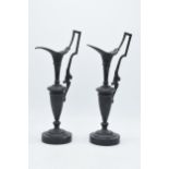A pair of attractive spelter vases with figural handles on slate bases (2), 31cm tall. Some chips to