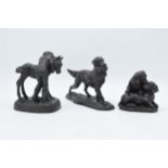 A trio of bronze-effect resin country figures to include spaniels carrying game and others (3),