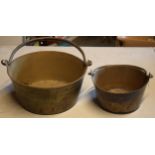 Antiques brass jam pans with metal handles (2), largest 31cm wide.