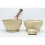 A pair of late 19th / early 20th century mortar and pestles to include Wedgwood Best Composition