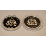 A pair of sterling silver proof-like coins to include Barbados One Dollar and another similar, in